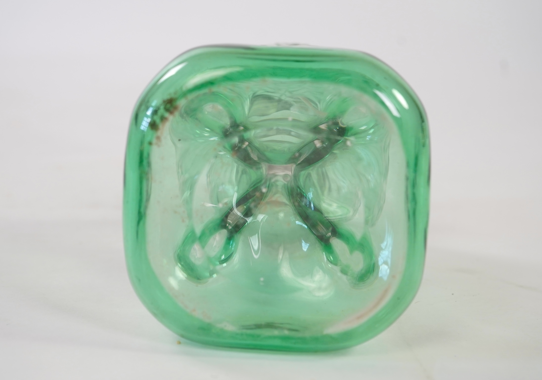 Attributed to Stevens and Williams of Stourbridge, a green flashed and cut pinched glass decanter